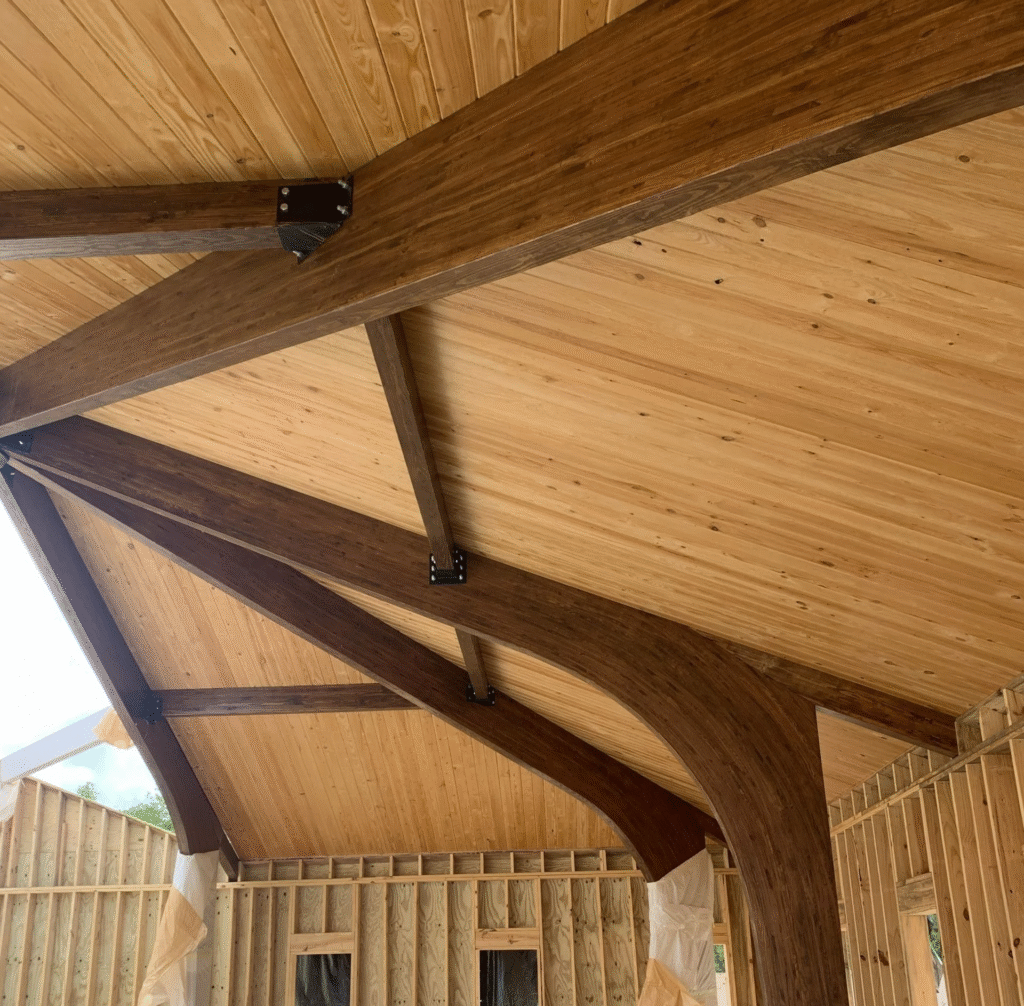 | binkley construction building in progress with timber trusses installed